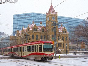 A CTrain passes Calgary City Hall on Wednesday, October 21, 2020.