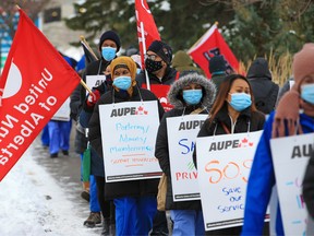 Healthcare workers protest during a walkout at the Foothills Hospital in Calgary on Monday, October 26, 2020.