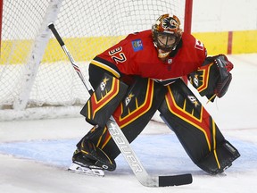 Flames Tyler Parsons minds the net during an NHL pre-season rookie game between the Edmonton Oilers and Calgary Flames in Calgary on Sunday, September 9, 2018.