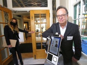 Statesman director Garth Mann and Sales and Events Director, Charlene Delisle officially opened its new event centre, Inn on Officers' Garden in the community of Currie as visitors to The Inn are greeted by a machine — a computer, with a body of sorts, called Dr. Wellness which provides an initial COVID screening test, in accordance with Alberta Health Services guidelines to help fight the novel coronavirus in Calgary on Thursday, October 15, 2020.