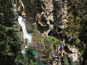 BANFF NATIONAL PARK: Crowds line up to enter the cave at Johnston Canyon in Banff National Park in July 2016.