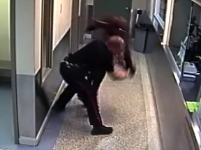 Frame grab from a video played in court showing Const. Alex Dunn throwing Dalia Kafi to the floor during an arrest in December 2017. Dunn is charged with assault causing bodily harm.