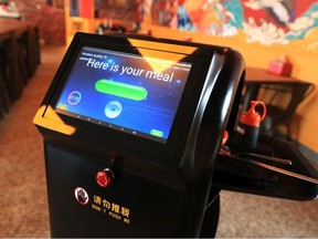 A robot at the recently opened Clay Pot Rice restaurant delivers food to tables on Thursday, October 15, 2020. 

Gavin Young/Postmedia