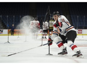 Team White centre Connor Zary skates during the Kubota OHL/NHL Top Prospects team white on-ice skills testing in Hamilton, Ont. on  Jan. 15, 2020. Peter Power/The Canadian Press