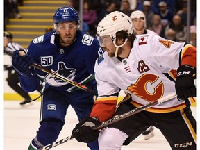 Sep 16, 2019; Victoria, British Columbia, CAN; Vancouver Canucks forward Josh Leivo (17) skates against Calgary Flames defenseman Rasmus Andersson (4) during the first period at Save-On-Foods Memorial Centre. Mandatory Credit: Anne-Marie Sorvin-USA TODAY Sports ORG XMIT: USATSI-406709