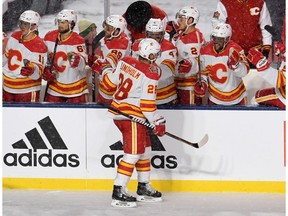 Oct 26, 2019; Regina, Saskatchewan, CAN; Calgary Flames center Elias Lindholm (28) celebrates his second period goal against the Winnipeg Jets during the 2019 Heritage Classic outdoor hockey game at Mosaic Stadium. Mandatory Credit: Candice Ward-USA TODAY Sports ORG XMIT: USATSI-405162