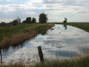 Lovely clouds reflected on an irrigation canal near Beiseker, Alberta, on May 29, 2012.