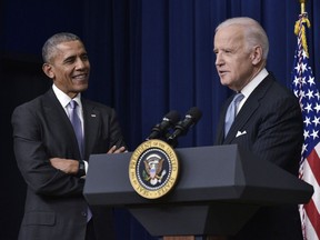 n this file photo taken on December 13, 2016, US Vice President Joe Biden (R) speaks, watched by US President Barack Obama, during the signing ceremony for the 21st Century Cures Act in the South Court Auditorium, next to the White House in Washington, DC.