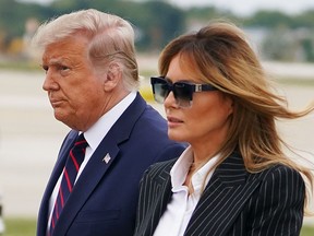 U.S. President Donald Trump and First Lady Melania Trump arrive in Cleveland, Ohio, on Sept. 28, 2020, for the first presidential debate. Trump and Melania have both tested positive for COVID-19.