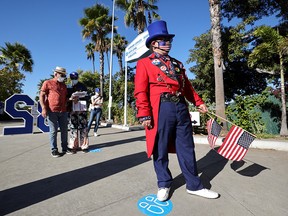 People keep social distance as they wait in line to vote in the U.S. presidential election on the first day of expanded California in-person voting in Los Angeles on Oct. 30, 2020.