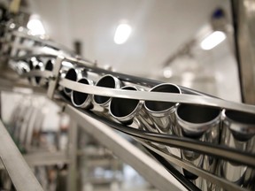 Beverage cans are run through machinery during a tour at a Canopy Growth facility in Smiths Falls, Ont., in 2019.