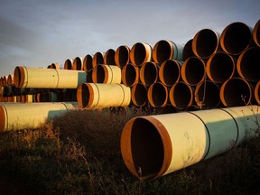 Miles of unused pipe, prepared for the proposed Keystone XL pipeline, sit in a lot on October 14, 2014 outside Gascoyne, North Dakota.