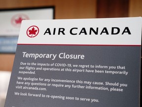 A "Temporary Closure" sign is displayed on an Air Canada ticketing counter in Terminal 2 at San Diego International Airport (SAN) in San Diego, California, U.S., on Monday, April 27, 2020.