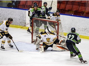 Calgary Canucks Ben Kotylak attempts to score against Old Grizzlys goalie Tristan Martin during the Alberta Junior Hockey League in Max Bell Arena on Wednesday, October 14, 2020. The Grizzlys won 3-2.  Azin Ghaffari/Postmedia