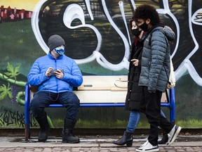Pedestrians wearing masks commute along Kensington Road on Monday, November 23, 2020.