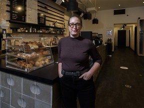 Jessica McCarrel owner of Kaffeeklatsch poses for a photo on Wednesday, November 25, 2020. The lack of workers coming to the core of the city due to the pandemic has hurt many businesses.
