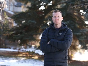 Olympic gymnastics medallist Kyle Shewfelt poses outside his southwest Calgary home on Wednesday, November 18, 2020.