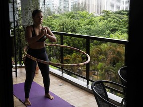 Renata Alfaia exercises at her house after recovering from the coronavirus disease (COVID-19), in Rio de Janeiro, Brazil, November 19, 2020. Picture taken November 19, 2020.
