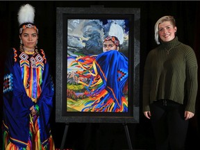 Calgary artist Lexi Hilderman, right, stands with Katari Righthand, who was the subject of her winning 2021 Calgary Stampede youth poster. Her artwork features fancy dancer Righthand with rainbow ribbons flowing from her regalia. The poster was unveiled on Tuesday, November 17, 2020.