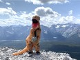 Richard Pastores, 27, is raising funds for the Calgary Food Bank by hiking mountains dressed as a dinosaur.