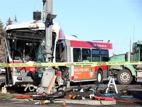 The wreckage is shown following a collision on 52 St and 90 Ave SE in Calgary on Thursday, November 26, 2020. The driver was pinned in the cab area of the Calgary Transit bus for about an hour before being rescued by crews and transported to hospital in serious but non-life threatening condition.