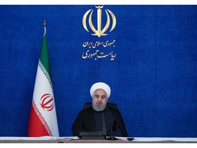 A handout picture provided by the Iranian Presidency on November 28, 2020, shows President Hassan Rouhani chairing a cabinet meeting in the capital Tehran. - Rouhani accused arch-foe Israel of trying to create "chaos" by assassinating one of Tehran's top nuclear scientists, but said his country will not fall into a "trap".