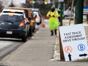 Cars line up for COVID-19 testing at the Richmond Road testing site in Calgary on Sunday, November 8, 2020. The province is experiencing a dramatic surge in COVID-19 cases.