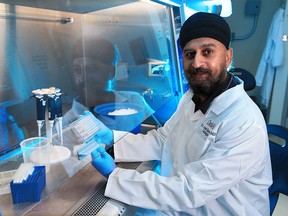 CardiAI CEO Dr. Anmol Kapoor simulates a test in the company's lab where a team of doctors and chemists have developed CoviLamp, the fastest and most accurate COVID-19 rapid test. He was photographed in the Calgary lab on Thursday, November 19, 2020.