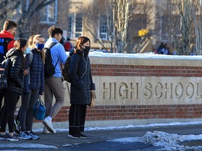 Western Canada High School students head out on their lunch break on the second last day of in-class instruction on Thursday, Nov. 26, 2020.