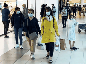 Shoppers at a mall in Toronto in October. The city has all but ended its contract tracing work, unable to keep up with the surge in infections.