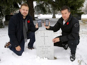 Matthew Cudmore, left, and Ryan Mullens are developing a mobile app called Faces of Valour that allows users to hold a phone next to a veteran's gravesite and access information and photographs of that veteran.