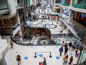 FILE PHOTO: People walk in the Eaton Centre shopping mall in Toronto, Ontario, Canada June 24, 2020.