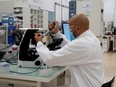A researcher works on vaccines in an industrial development laboratory France, on June 16.