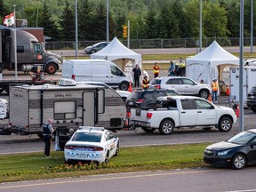 Motorists from the mainland go through checkpoints after they came off Confederation Bridge in Borden-Carleton, P.E.I., Friday, July 7, 2020.