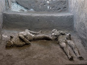 This undated photo handout on November 21, 2020 by the Pompeii Archaeological Park shows casts of the bodies of two men, a 40-year-old master and his young slave, after they were found during recent excavations of a Villa in Civita Giuliana in the outskirts of Pompeii, as Park officials said conditions were optimal to get casts of the victims, following the technique perfected in 1863 by Giuseppe Fiorelli. - The ancient Roman city of Pompeii was engulfed under a hail of volcanic ash after nearby Mount Vesuvius erupted in the year 79. Vesuvius' eruption covered the in a toxic, metres-thick layer of volcanic ash, gases and lava flow which then turned to stone, encasing the city, allowing an extraordinary degree of frozen-in-time preservation both of city structures and of residents unable to flee.
