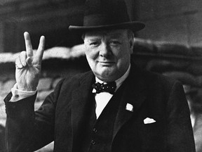 Sir Winston Churchill in a familiar pose from the Second World War.