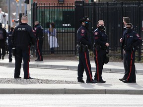 Police patrol after an incident near the Calgary Drop-In Centre on Wednesday, November 4, 2020. Council approved a motion Wednesday to consider removing $20 million from the CPS budget over the next two years.