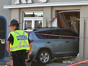 The scene where an elderly woman was struck by a vehicle and driven through a window of a Kentucky Fried Chicken outlet in Edmonton on July 18, 2018.