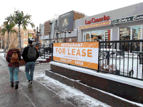 Store fronts with for-lease signs along 17th Avenue S.W. on Friday, Nov. 13.