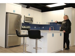 Children's Cottage Society CEO Patti Kilgallon in the new kitchen provided by Morrison Homes.