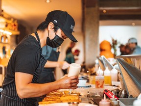 A Launch Pad chef prepares a meal.