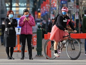 Calgarians wear masks in the downtown area on Tuesday, November 3, 2020.