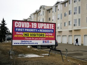 A COVID-19 sign at Shepherd's Care Kensington Village, a seniors care residence in Edmonton. File photo.