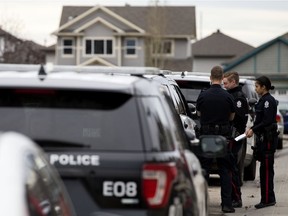 Police work at the scene of a possible shooting near Tamarack Road and 37A Avenue, in Edmonton on Nov. 4, 2020. The shooting was one of seven that occurred during the span of a week in early November.