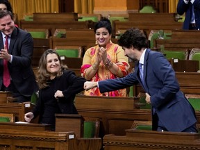 Finance Minister Chrystia Freeland receives a fist-bump from Prime Minister Justin Trudeau after unveiling her first fiscal update, the Fall Economic Statement 2020, on Monday.