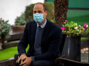 Britain's Prince William, Duke of Cambridge meets patients and staff during a visit to attend the ground-breaking ceremony for the Oak Cancer Centre at The Royal Marsden hospital in central London on October 21, 2020.