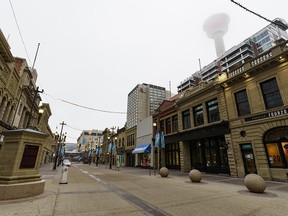 Stephen Avenue is almost empty on a foggy morning before the holiday season on Friday, December 11, 2020.