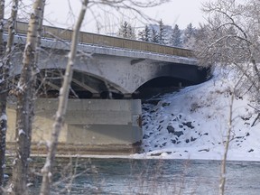 The 16 Avenue bridge on Bow River near Shouldice Park is partially closed while crews examine the damage done to the bridge from a fire at a homeless camp under the bridge on Sunday, Dec. 27, 2020.
