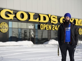 Arvinder Singh poses for a photo outside Gold’s Gym in Country Hills on Sunday, Dec. 27, 2020. Singh, a long-time member at Gold’s Gym, is among people who are still being charged for membership despite the shutdown.