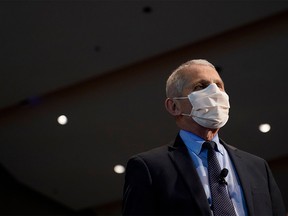 Anthony Fauci, director of the National Institute of Allergy and Infectious Diseases, looks on after receiving the first dose of the COVID-19 vaccine at the National Institutes of Health on Dec. 22, 2020, in Bethesda, Maryland.